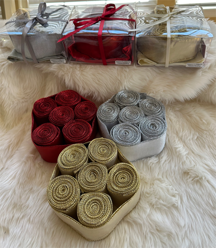 rolls of red, sliver, gray ribbon