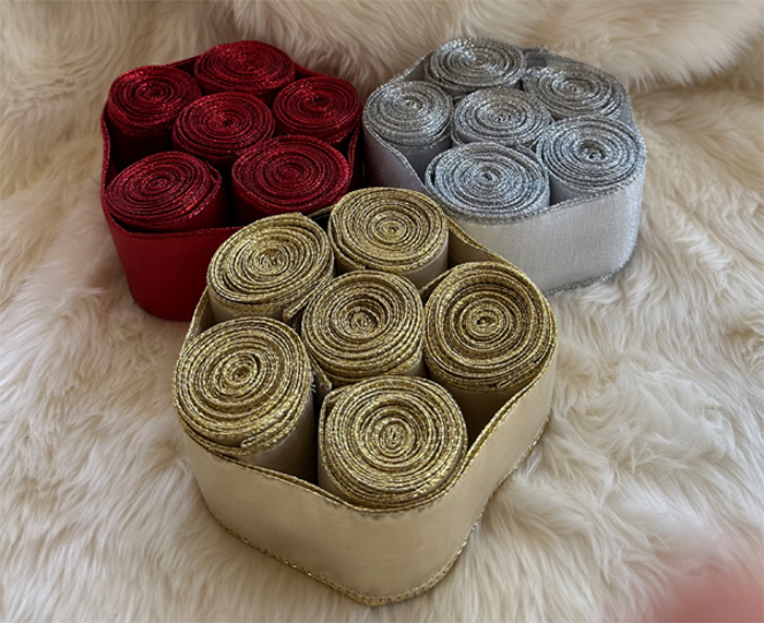 Rolls of red, silver and gold ribbon